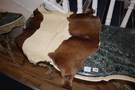 A pony skin rug and four goat skin mats, pony skin, 200 x 180cm